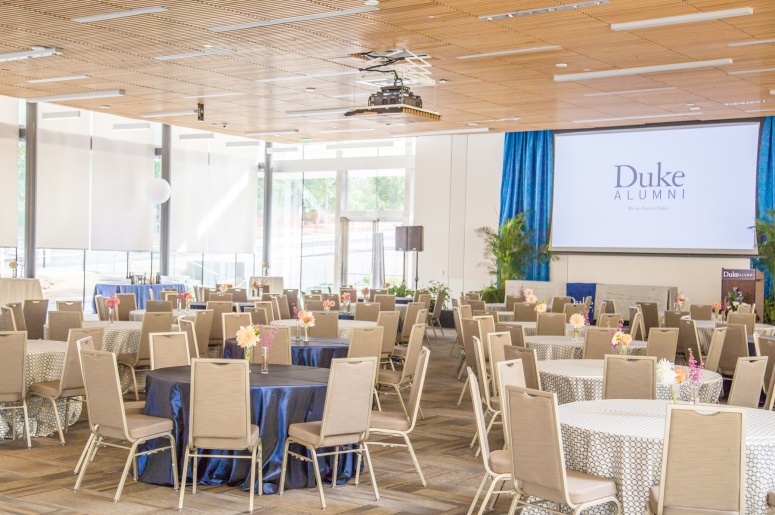 Photo of room set up with tables and chairs for a Duke Alumni event at Penn Pavilion