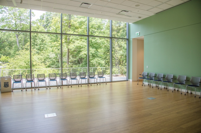 Photo of the light-filled Student Wellness Center Room 148 and chairs in the room