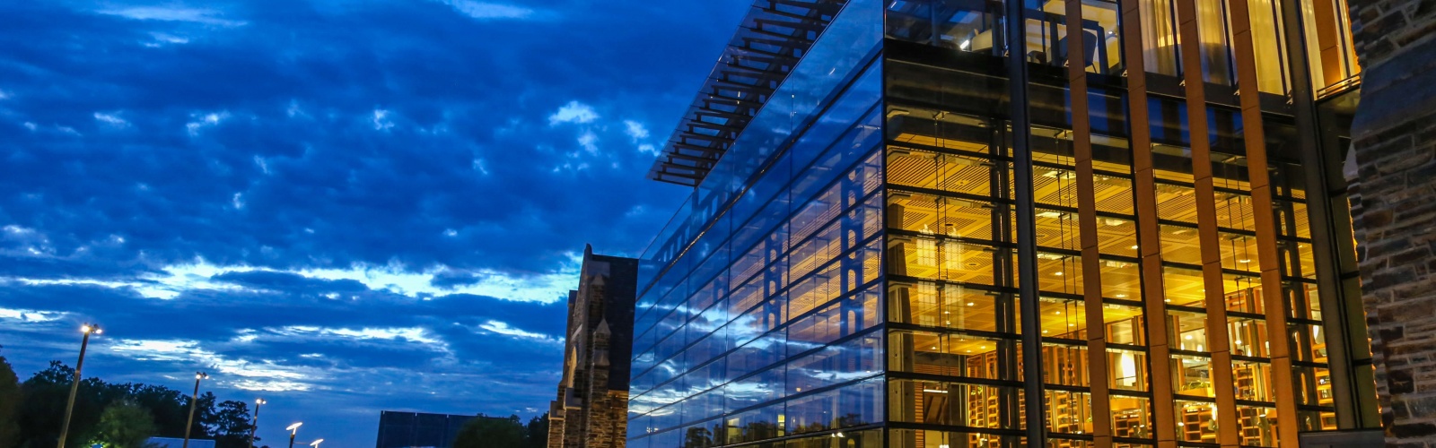 Outside view of the Brodhead Center from the Plaza at dusk